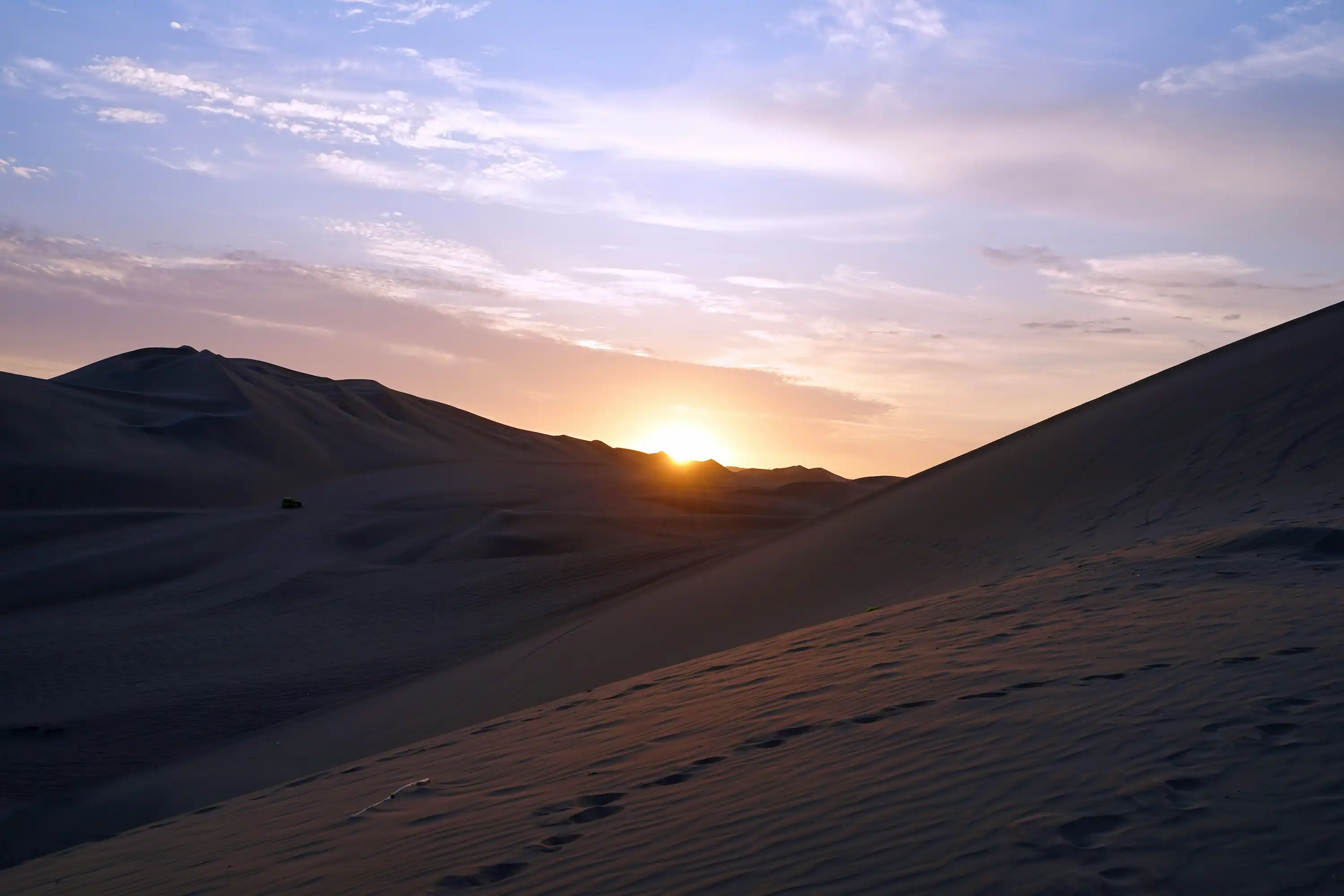 Watch the sunrise or sunset over the dunes